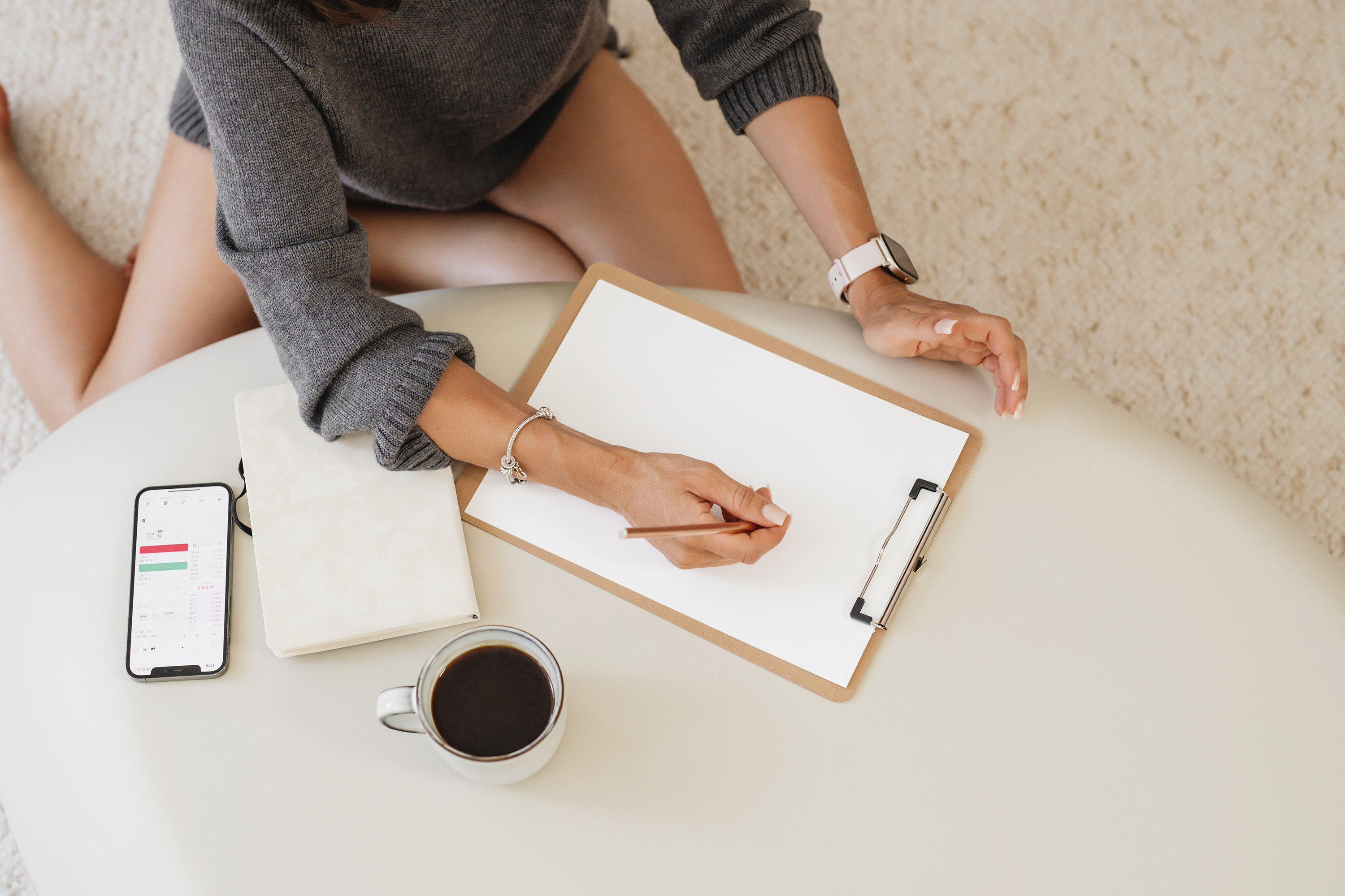 A bright morning workspace with coffee and a notebook